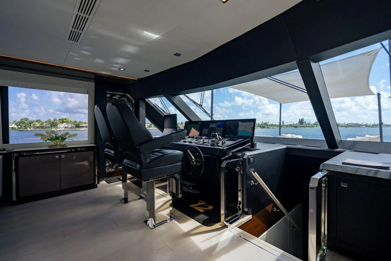 The helm station offers a commanding view with state-of-the-art navigation equipment and luxurious seating. aboard M/Y 12 Yacht for Sale