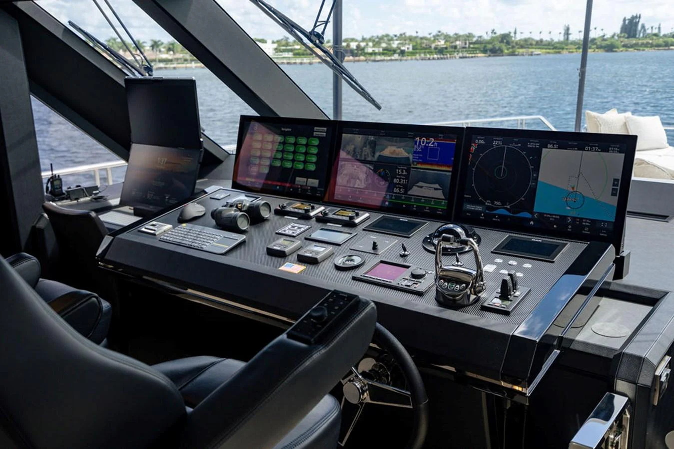 The helm station features advanced navigation equipment and luxurious seating with a panoramic view. aboard M/Y 12 Yacht for Sale