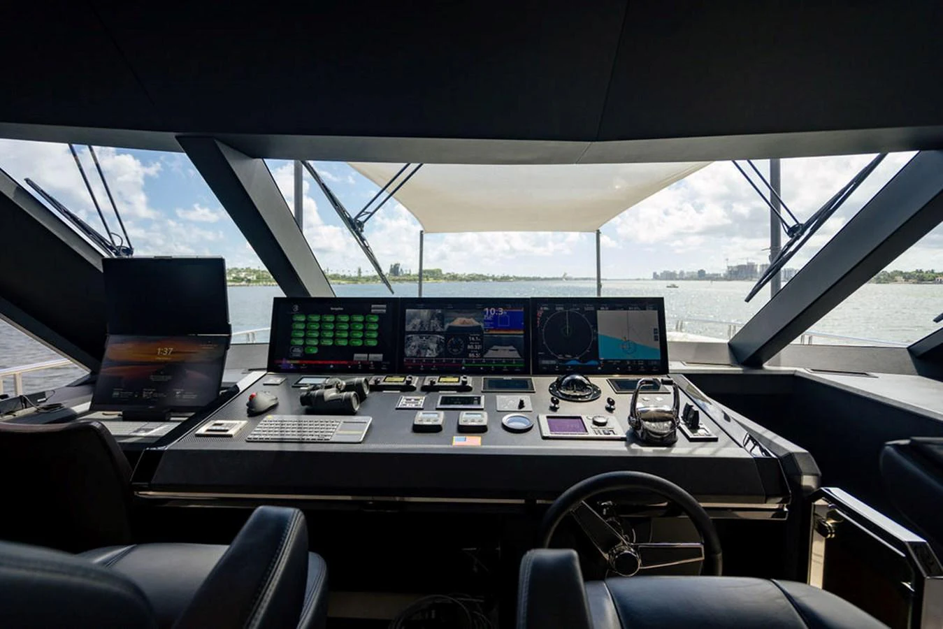 The helm station offers a panoramic view with advanced navigation equipment and luxurious seating. aboard M/Y 12 Yacht for Sale