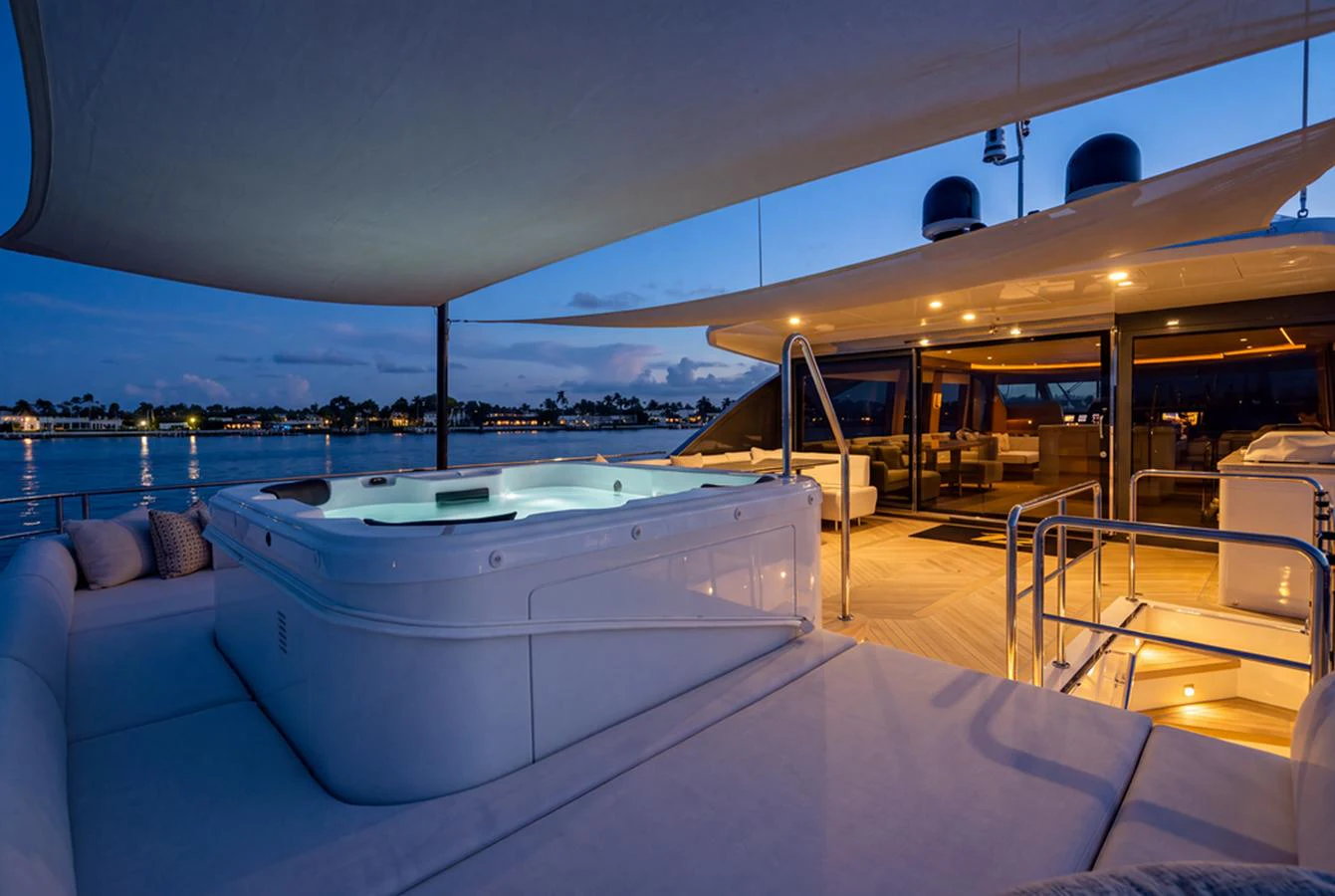 The sundeck features a luxurious hot tub with ample seating and ambient lighting, perfect for relaxation. aboard M/Y 12 Yacht for Sale