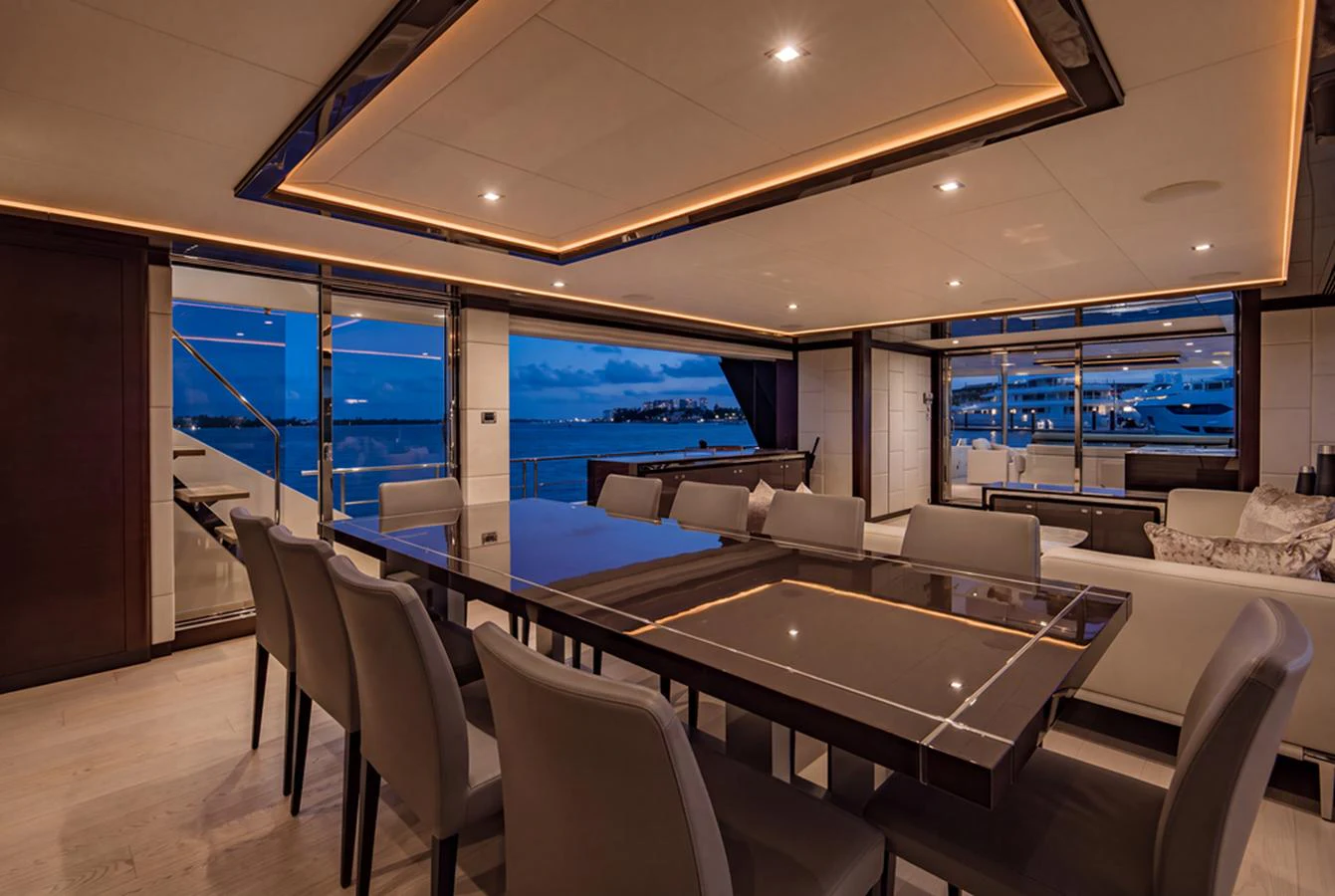 The elegant dining area offers a sophisticated setting with panoramic views of the marina. aboard M/Y 12 Yacht for Sale
