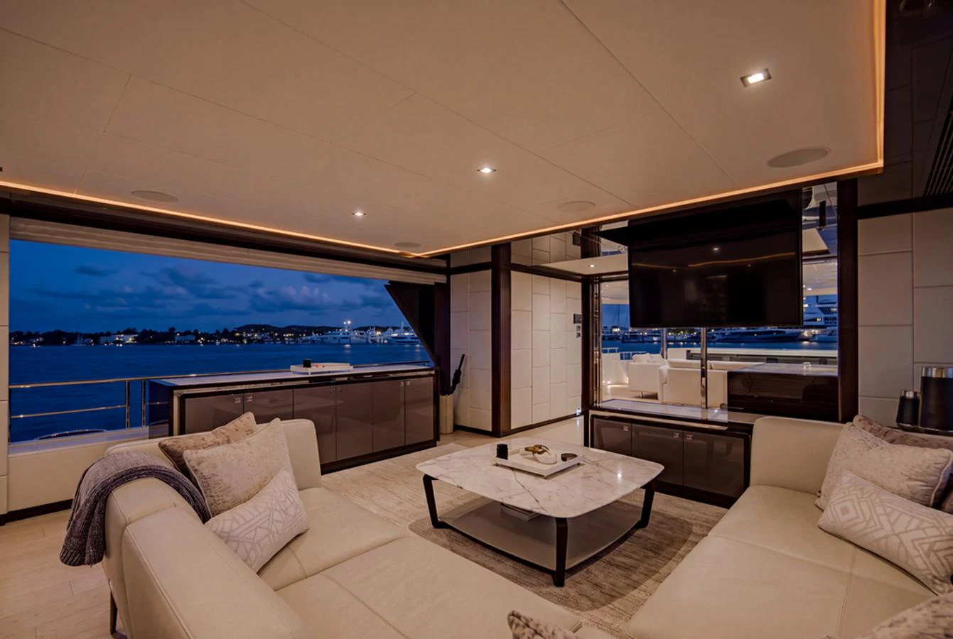 The salon offers a spacious and luxurious area with comfortable seating and a stunning view of the water. aboard M/Y 12 Yacht for Sale