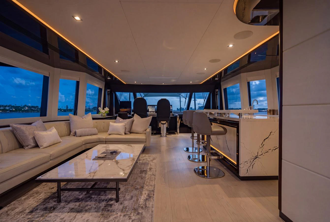 The salon features a spacious seating area with luxurious furnishings and panoramic windows offering stunning views. aboard M/Y 12 Yacht for Sale