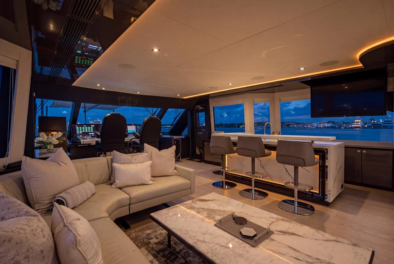 The salon offers a luxurious and spacious area with modern furnishings and a stunning view. aboard M/Y 12 Yacht for Sale