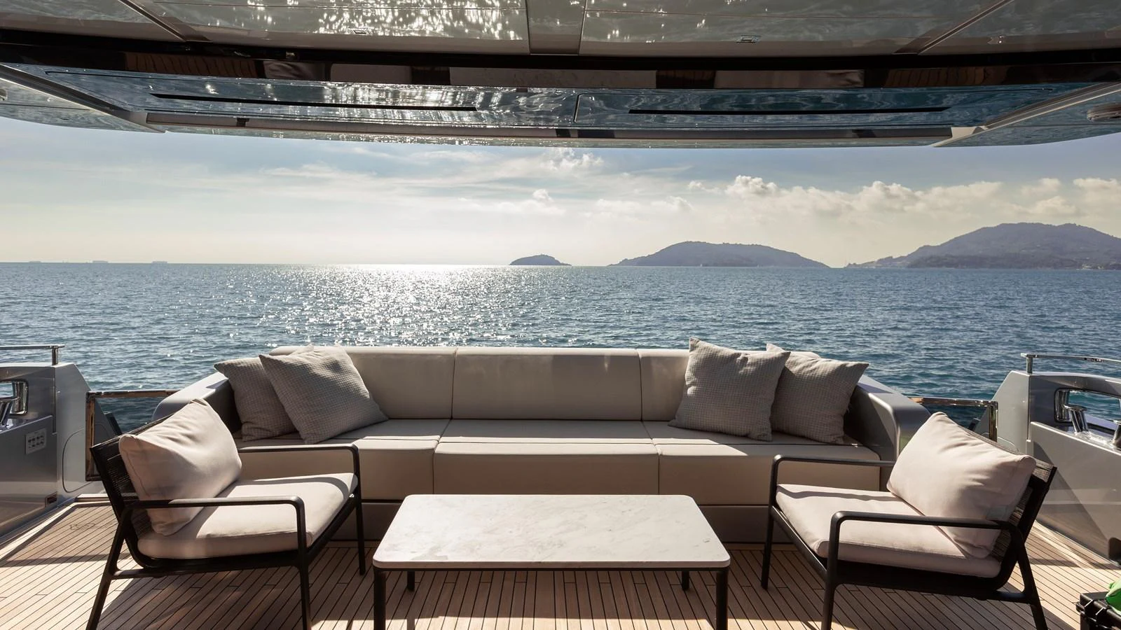 The aft deck features a luxurious seating area with stunning ocean views. aboard GIO4 Yacht for Sale