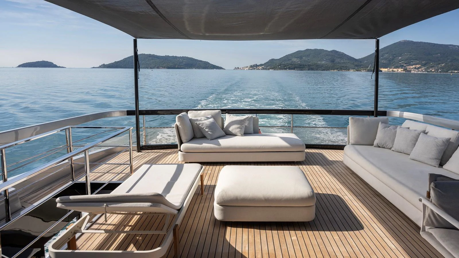 The aft deck offers a serene lounging area with plush seating and stunning sea views. aboard GIO4 Yacht for Sale