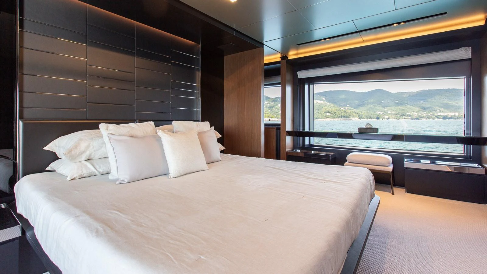 The master stateroom offers a luxurious retreat with panoramic views of the water. aboard GIO4 Yacht for Sale