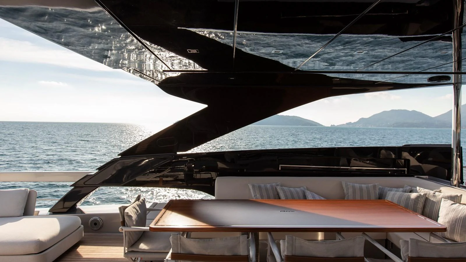 The aft deck offers a stylish and comfortable outdoor dining area with stunning sea views. aboard GIO4 Yacht for Sale