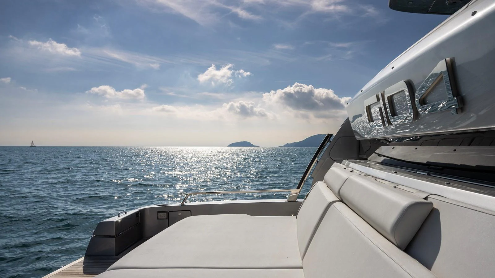 The aft deck of the yacht offers a serene view of the open sea under a bright sky. aboard GIO4 Yacht for Sale