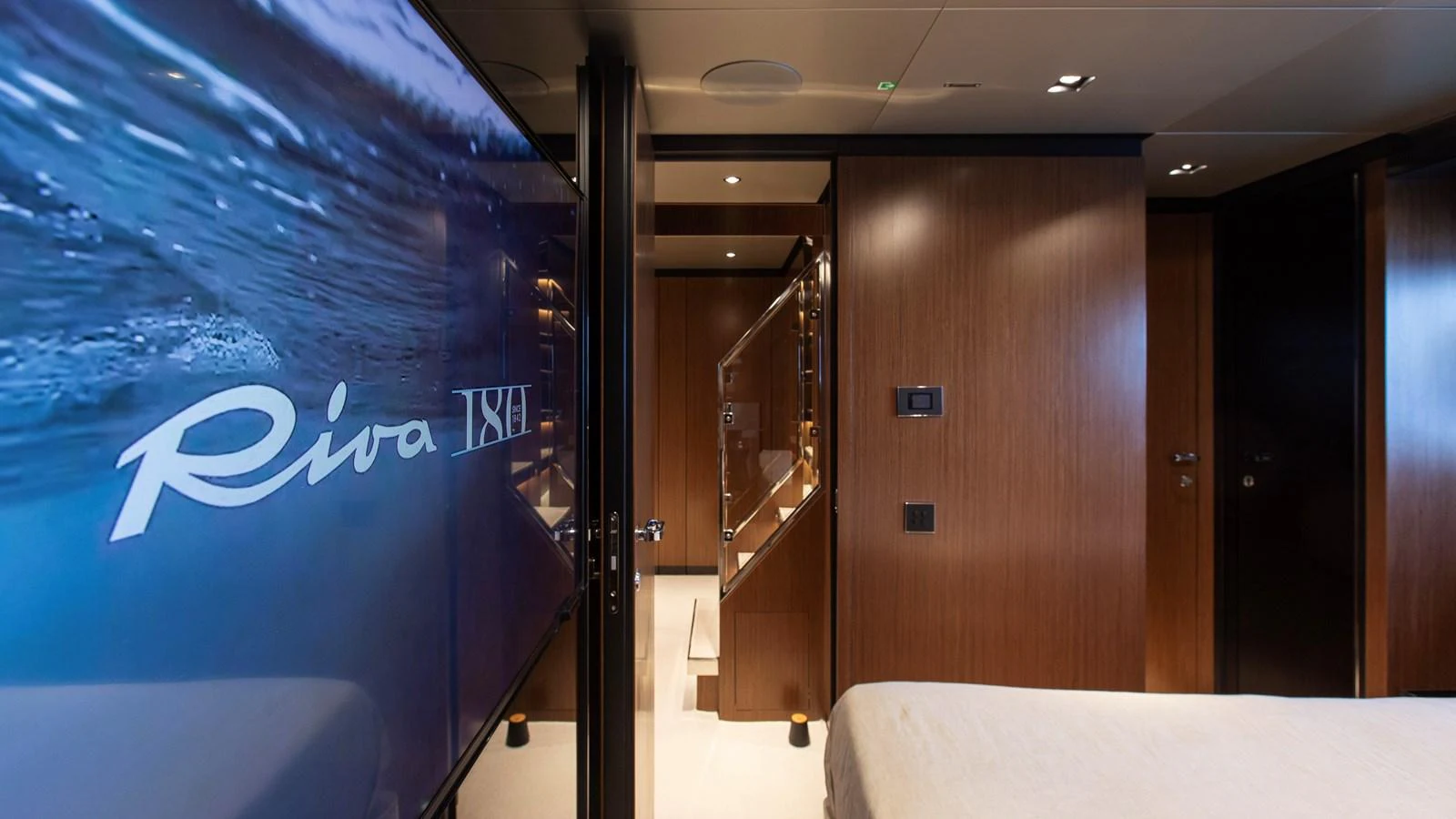 The stateroom features elegant wood paneling and modern amenities, creating a luxurious and comfortable retreat. aboard GIO4 Yacht for Sale