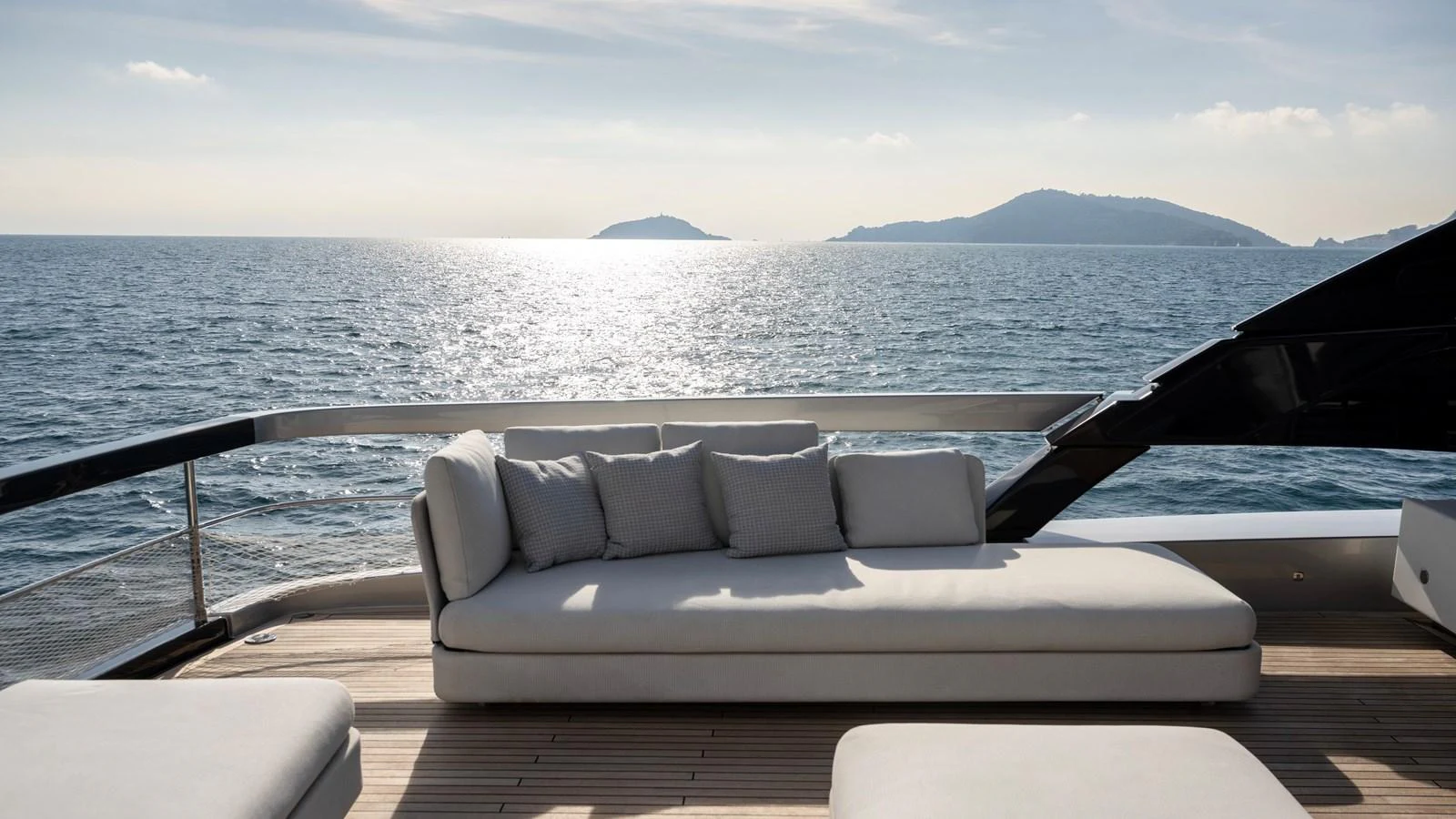 The aft deck features a luxurious lounging area with stunning ocean views. aboard GIO4 Yacht for Sale