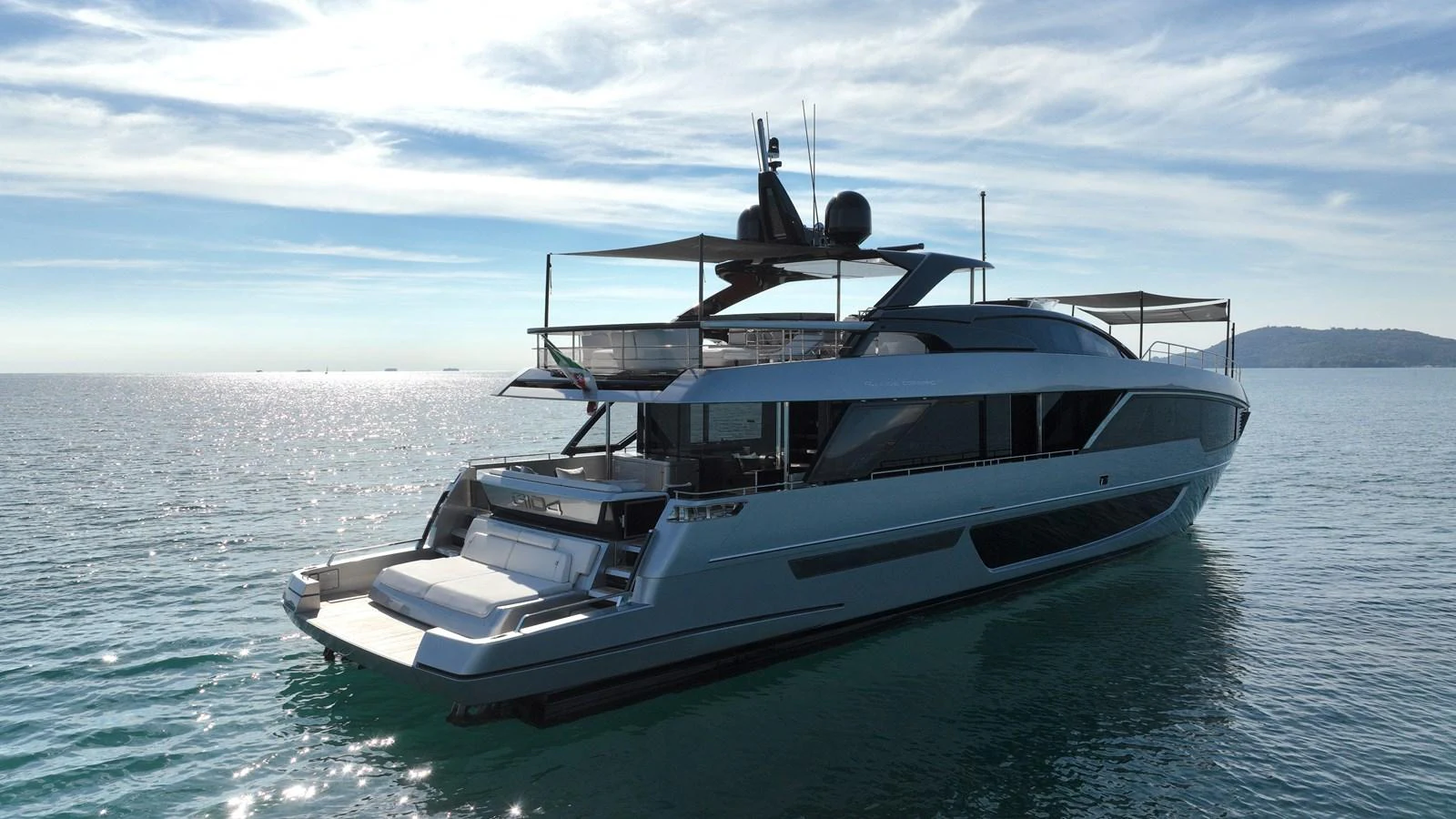 A sleek and modern yacht glides gracefully on calm waters under a clear sky. aboard GIO4 Yacht for Sale