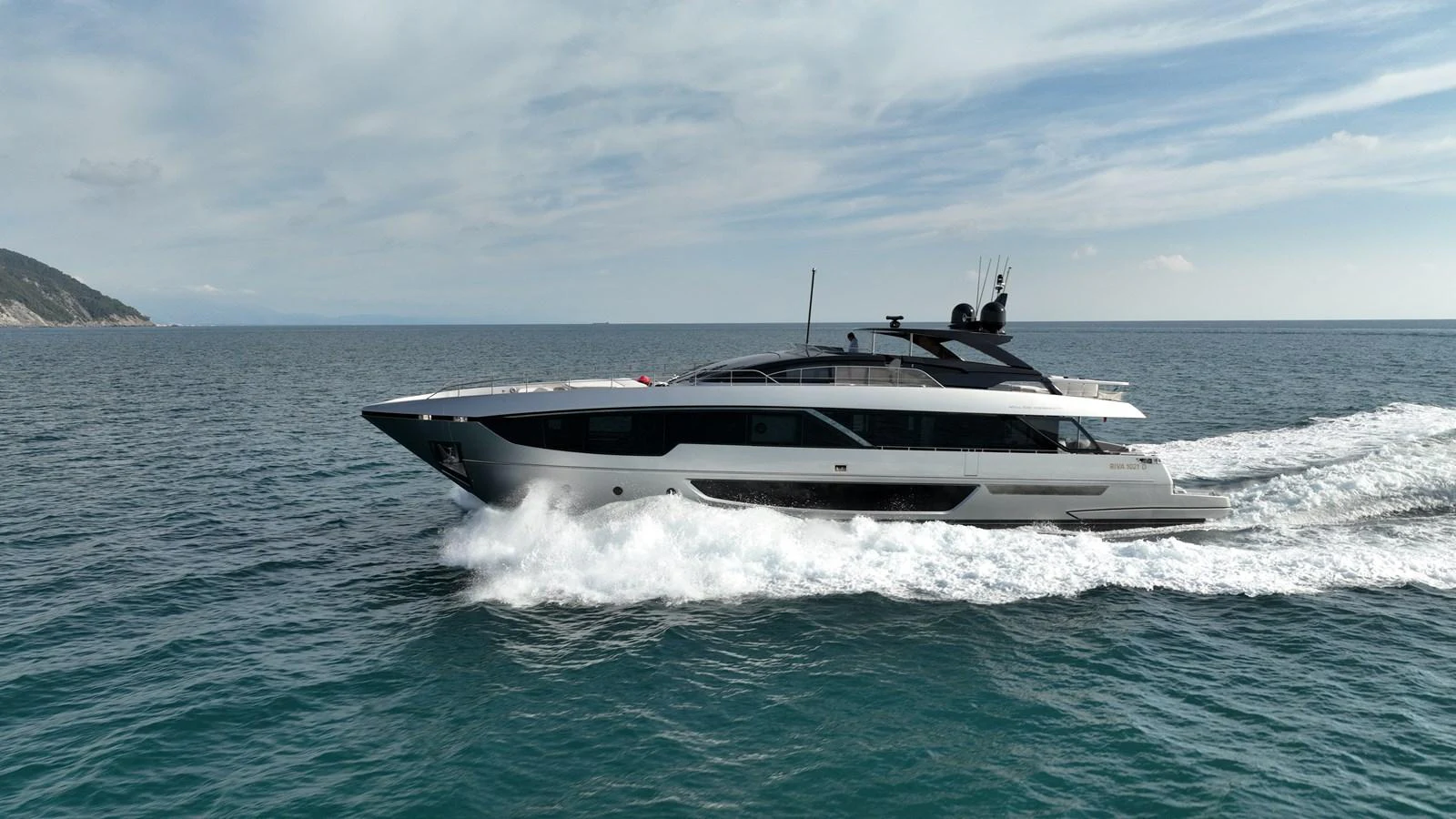 A sleek, modern yacht cruises swiftly through the open sea. aboard GIO4 Yacht for Sale