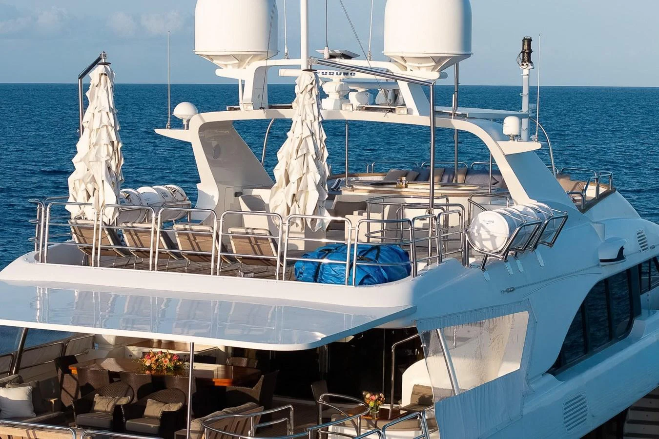The yacht's sundeck offers a luxurious space with ample seating and shaded areas, perfect for relaxation and entertainment. aboard GOTTA GO Yacht for Sale