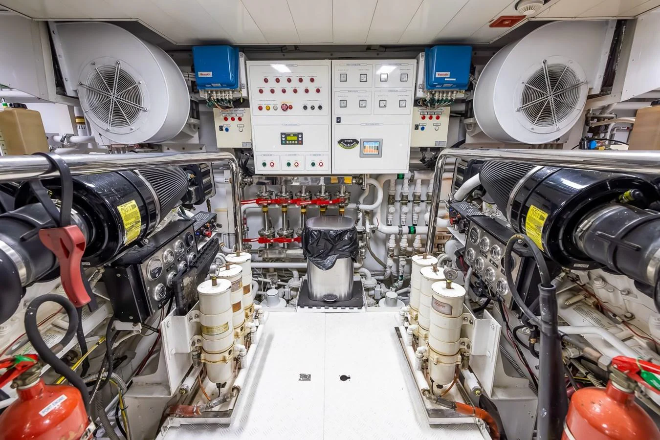 The engine room is meticulously organized with advanced machinery and control panels. aboard GOTTA GO Yacht for Sale