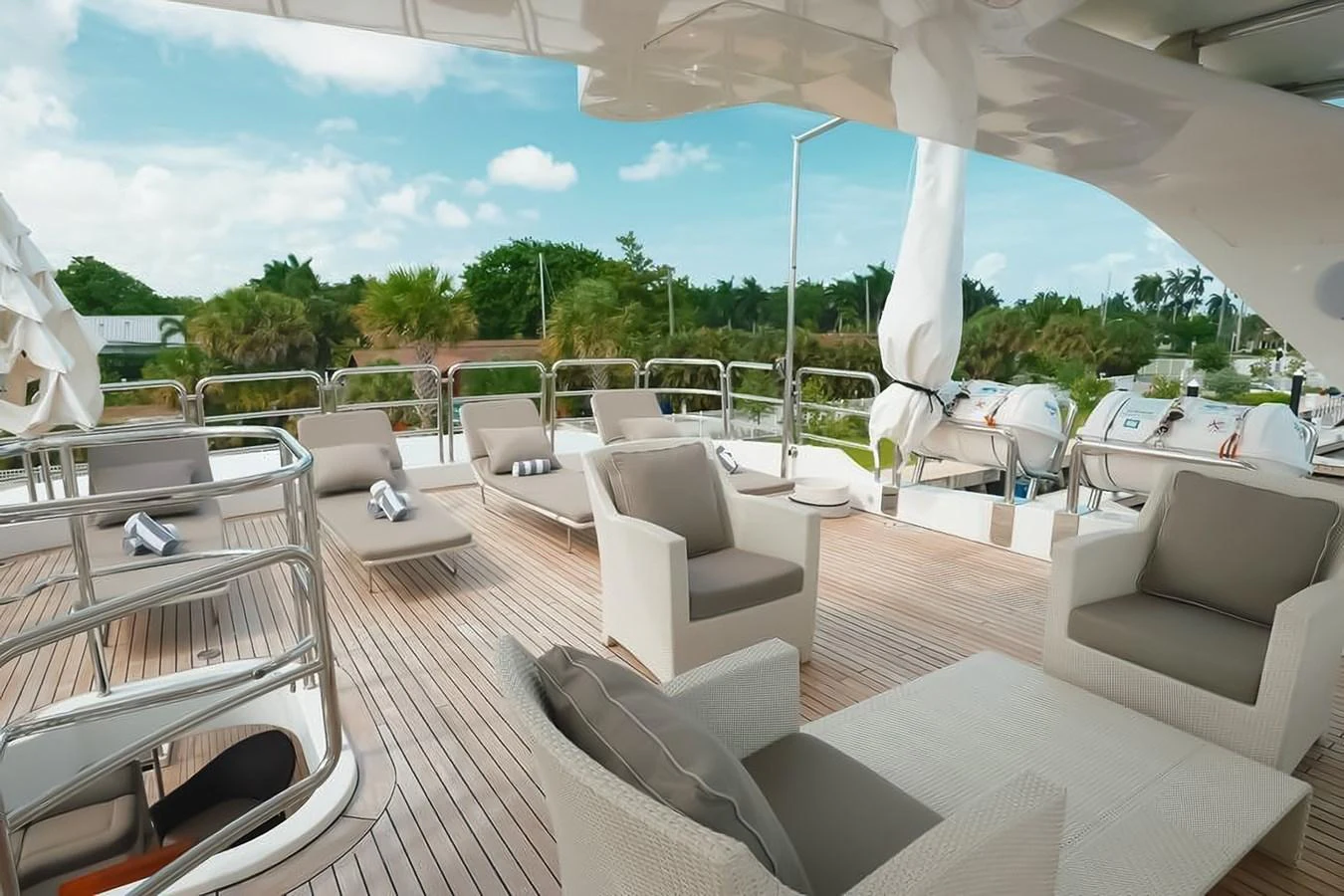 The sundeck offers a spacious and inviting area with comfortable seating and sun loungers for relaxation. aboard GOTTA GO Yacht for Sale
