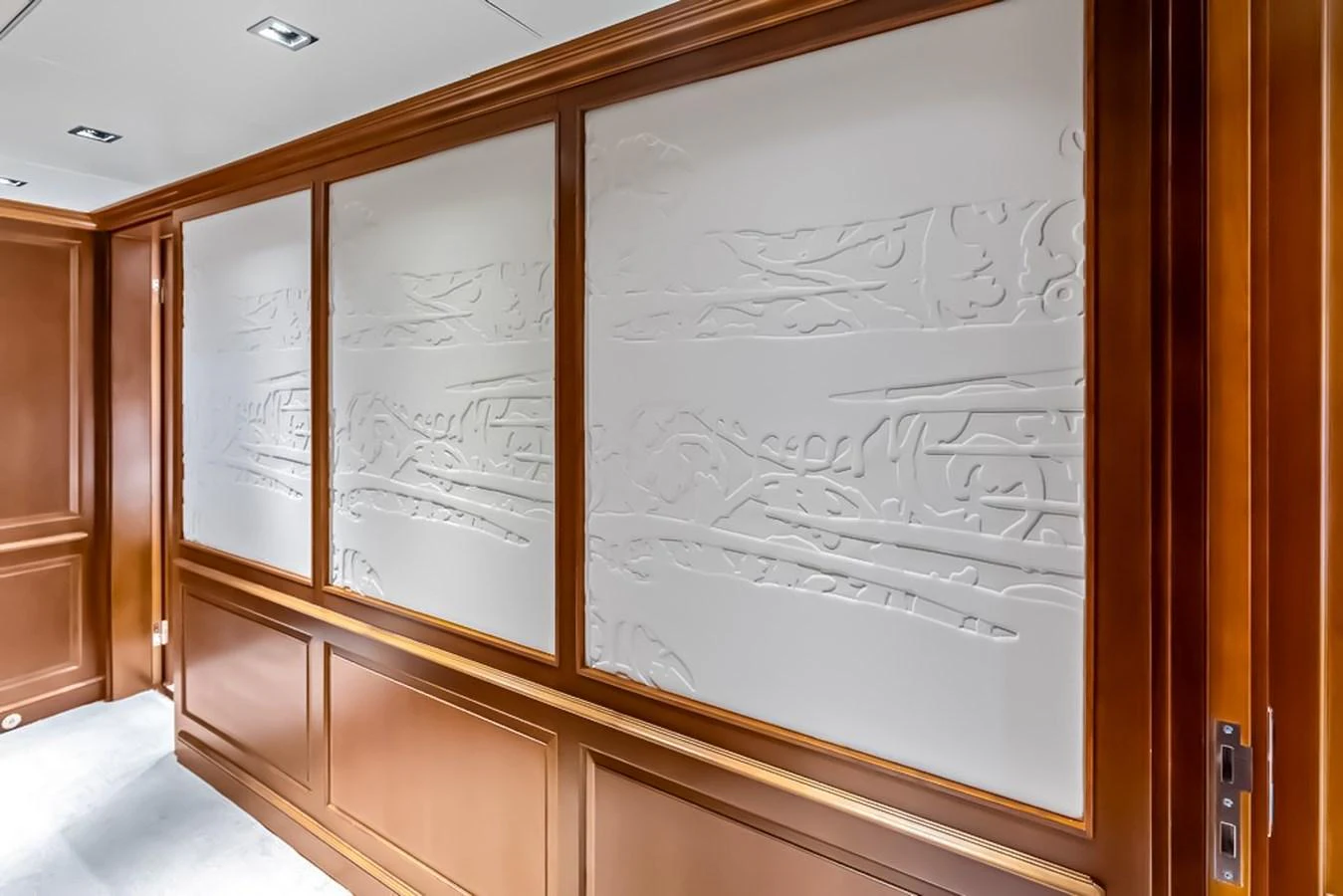 The yacht's interior features elegant wood paneling and intricate wall designs. aboard GOTTA GO Yacht for Sale