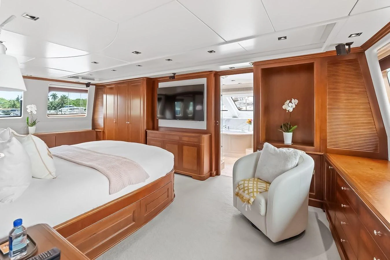 The master stateroom features a spacious layout with elegant wood finishes and modern amenities. aboard GOTTA GO Yacht for Sale