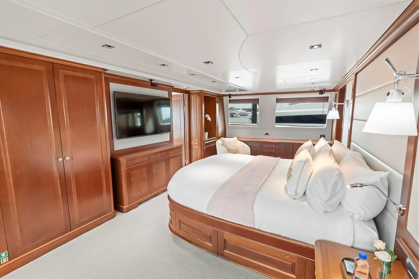 The master stateroom features a luxurious bed, ample storage, and modern amenities for ultimate comfort. aboard GOTTA GO Yacht for Sale