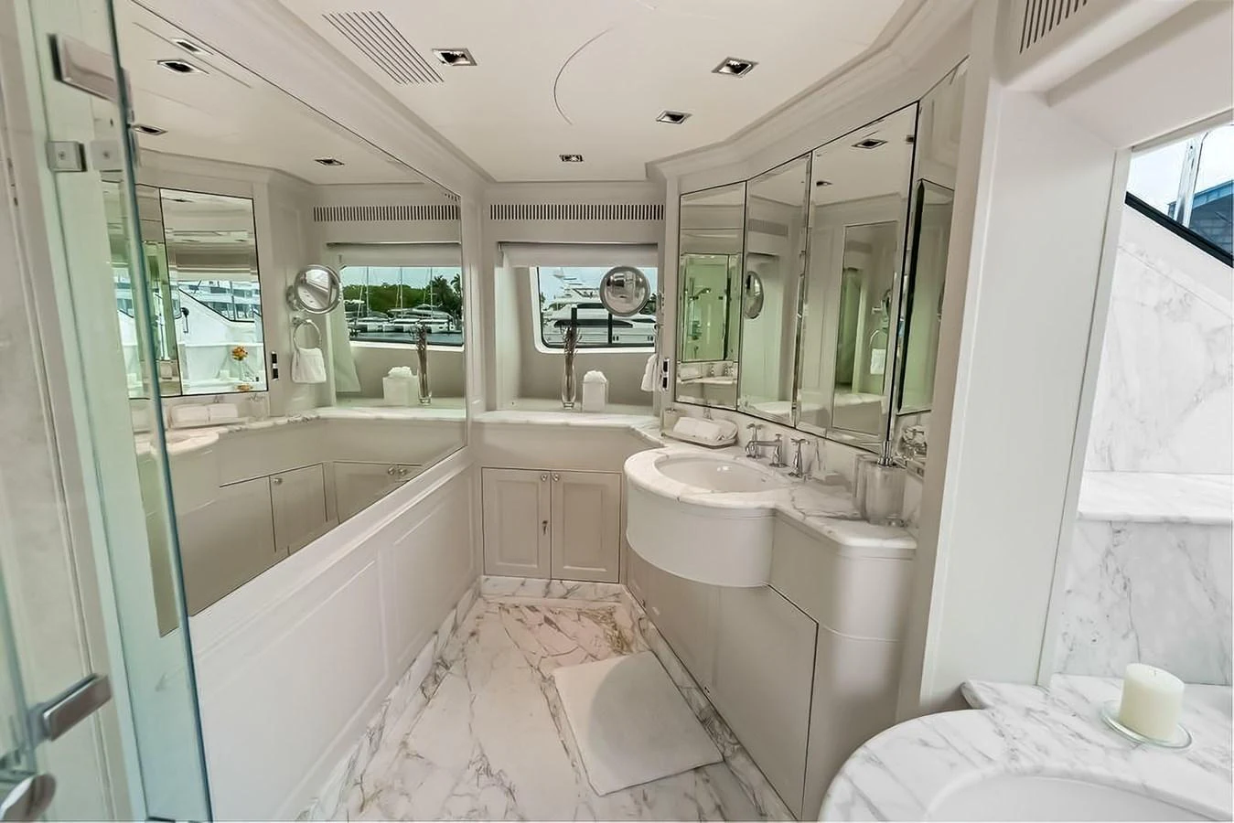 The yacht's bathroom features elegant marble surfaces and ample mirrors, creating a luxurious and spacious feel. aboard GOTTA GO Yacht for Sale
