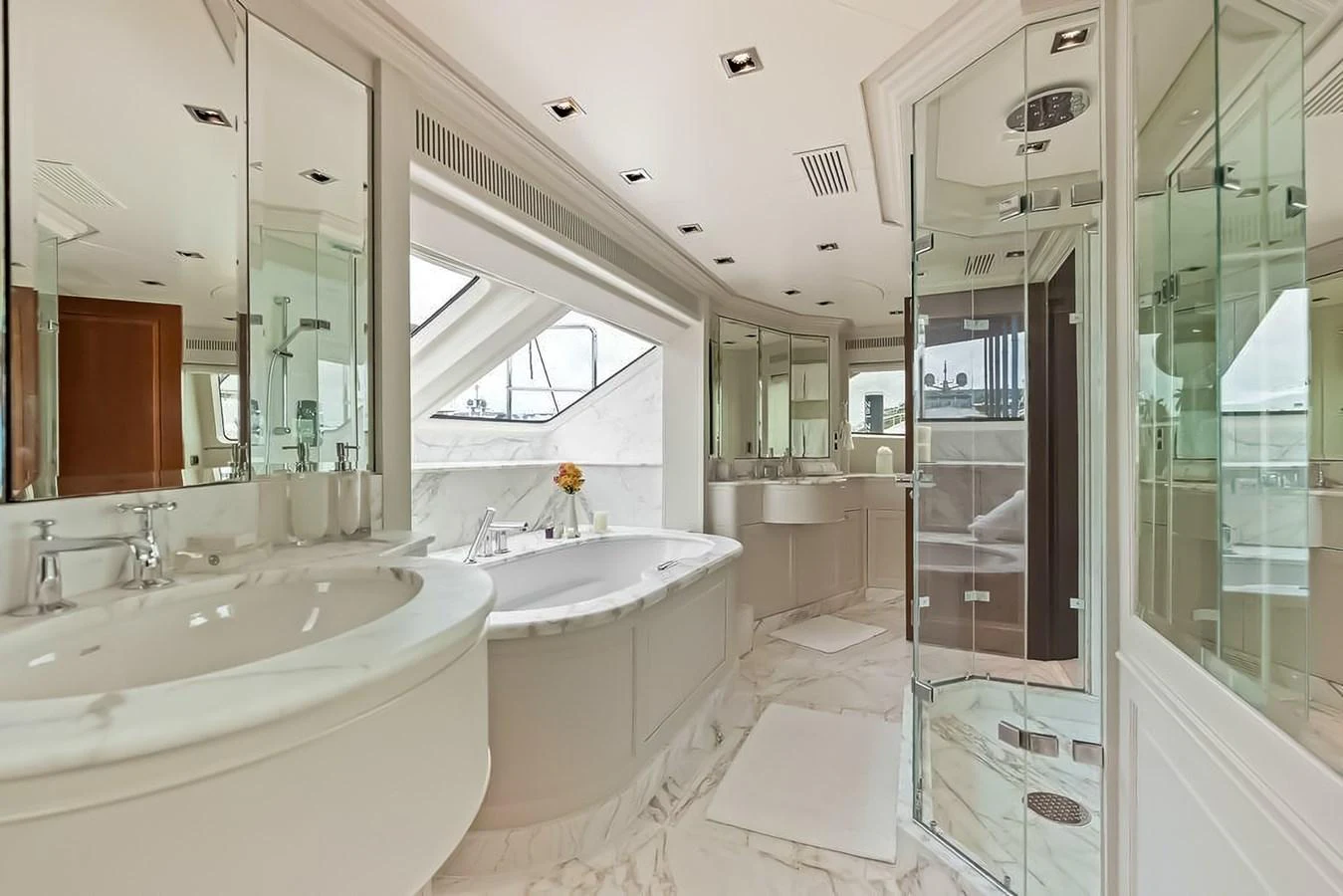 The yacht's bathroom features luxurious fixtures, a spacious layout, and elegant marble finishes. aboard GOTTA GO Yacht for Sale