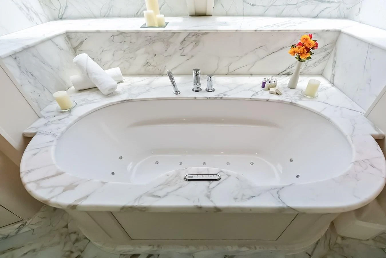 Luxurious marble bathroom with a spacious bathtub and elegant fixtures. aboard GOTTA GO Yacht for Sale