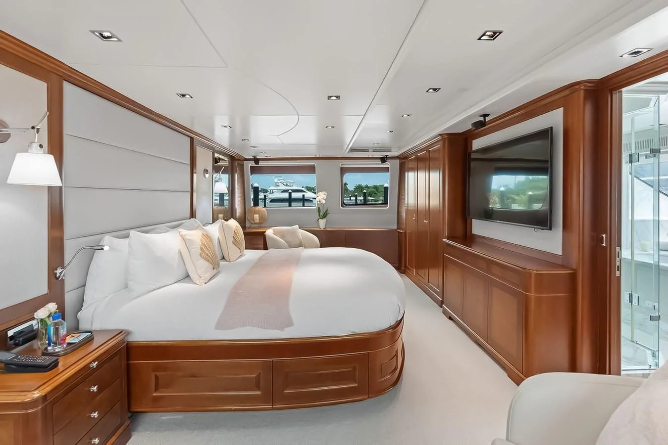 The master stateroom offers a luxurious and spacious retreat with elegant wood finishes and modern amenities. aboard GOTTA GO Yacht for Sale