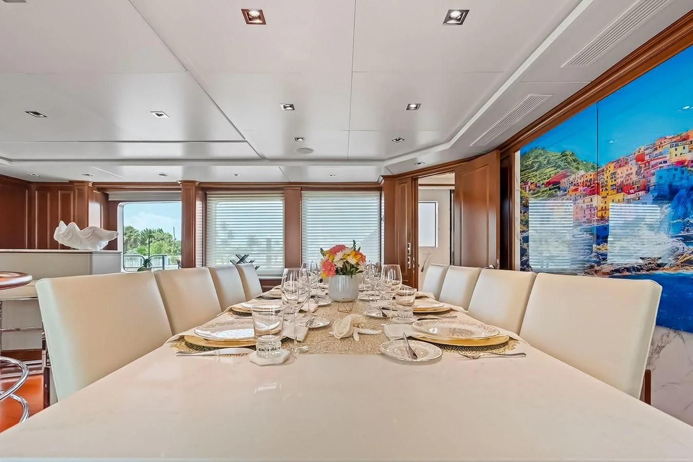 The yacht's dining area features a beautifully set table with elegant decor and ample seating. aboard GOTTA GO Yacht for Sale