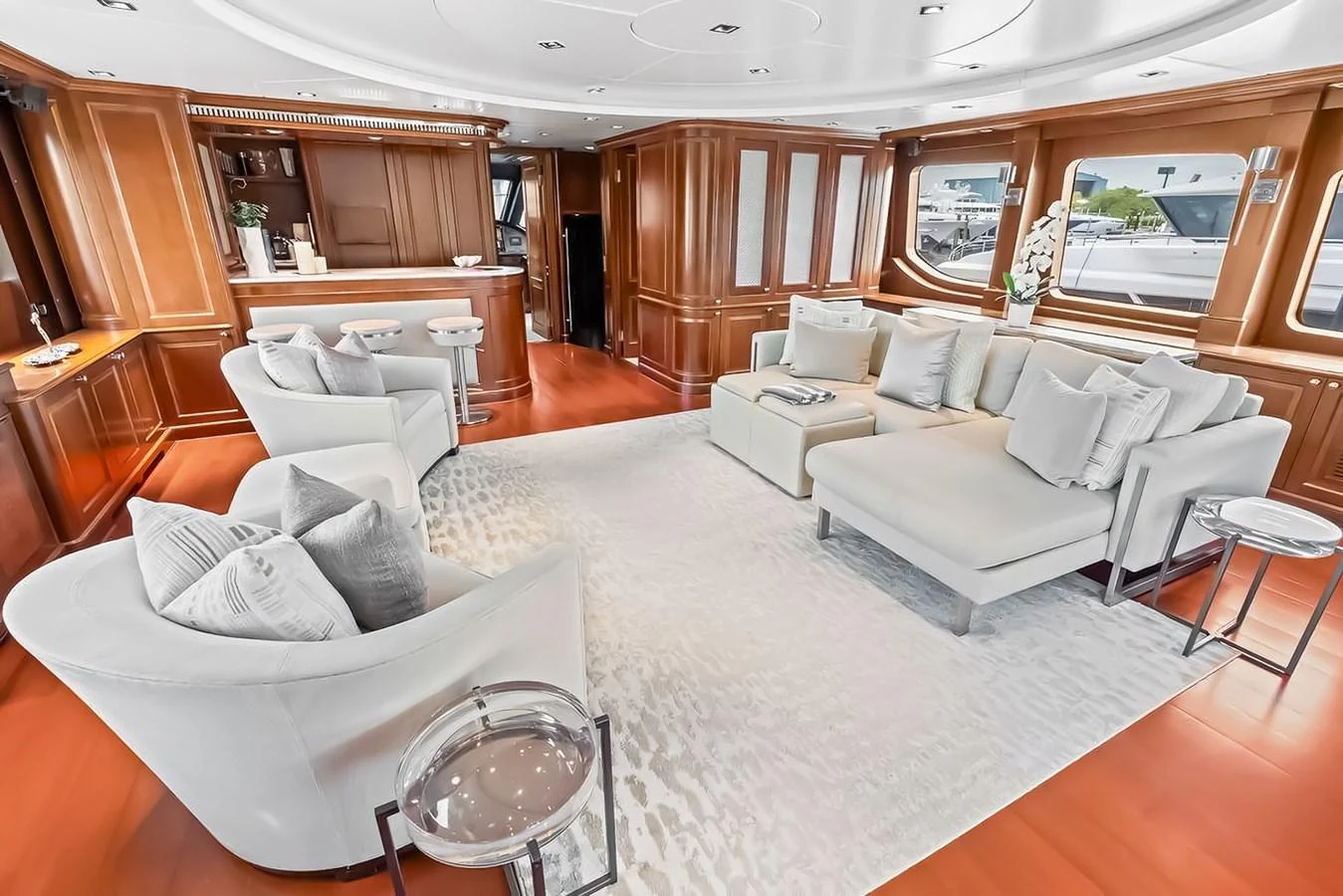 The salon features plush seating and elegant wood paneling, creating a luxurious and inviting atmosphere. aboard GOTTA GO Yacht for Sale