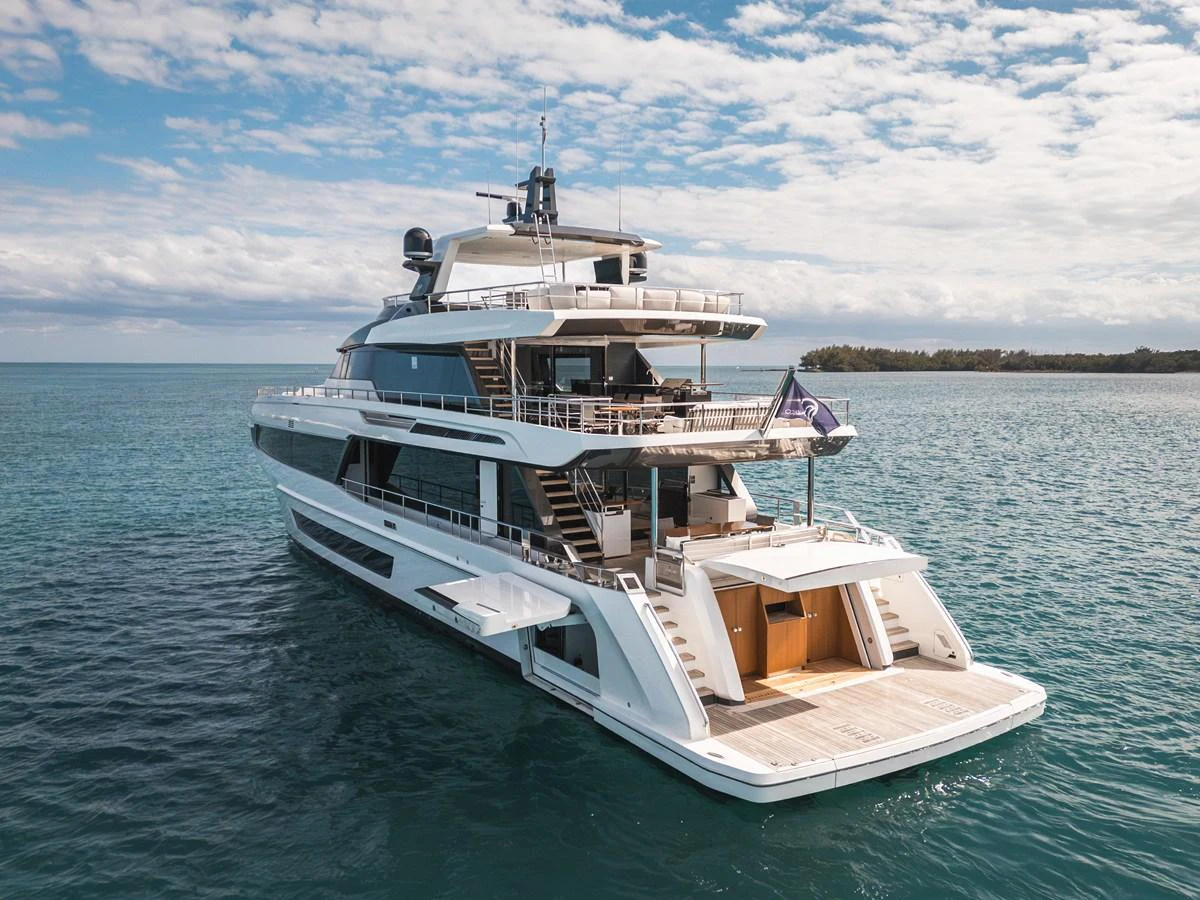 A luxurious yacht glides gracefully on serene waters under a partly cloudy sky. aboard OCEAN ALEXANDER 35P05 Yacht for Sale