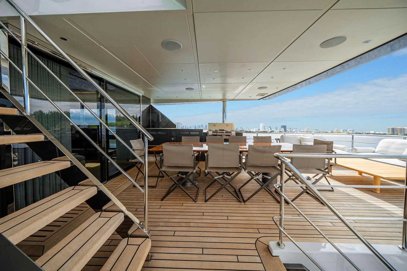 The aft deck features a spacious outdoor dining area with a stunning view. aboard OCEAN ALEXANDER 35P05 Yacht for Sale