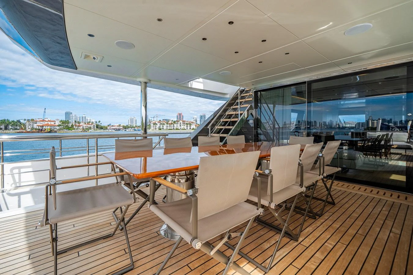 The aft deck features a spacious dining area with a beautiful view of the water. aboard OCEAN ALEXANDER 35P05 Yacht for Sale