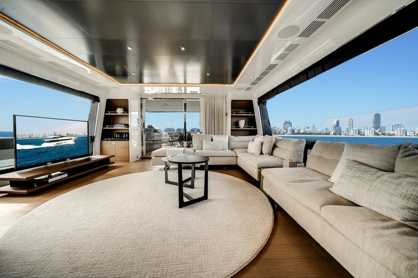 The salon offers a spacious and luxurious seating area with panoramic views of the sea and cityscape. aboard OCEAN ALEXANDER 35P05 Yacht for Sale
