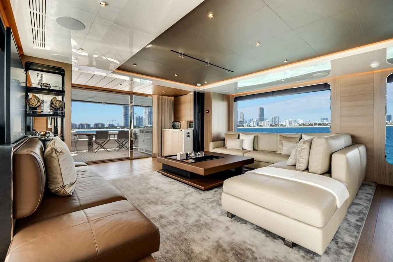 The spacious salon features luxurious seating and expansive windows with stunning views. aboard OCEAN ALEXANDER 35P05 Yacht for Sale