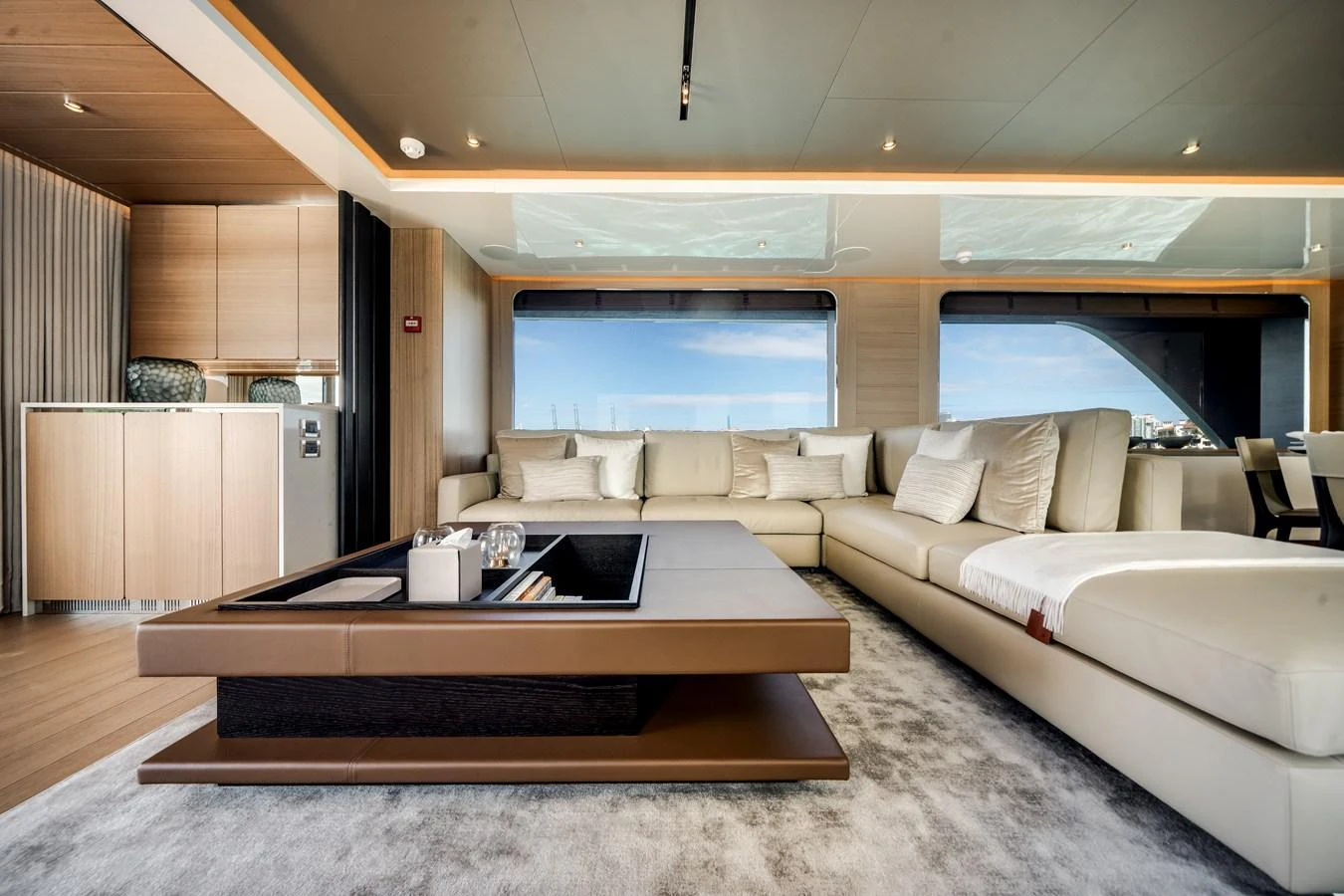 The salon features a spacious and elegant seating area with large windows offering stunning views. aboard OCEAN ALEXANDER 35P05 Yacht for Sale