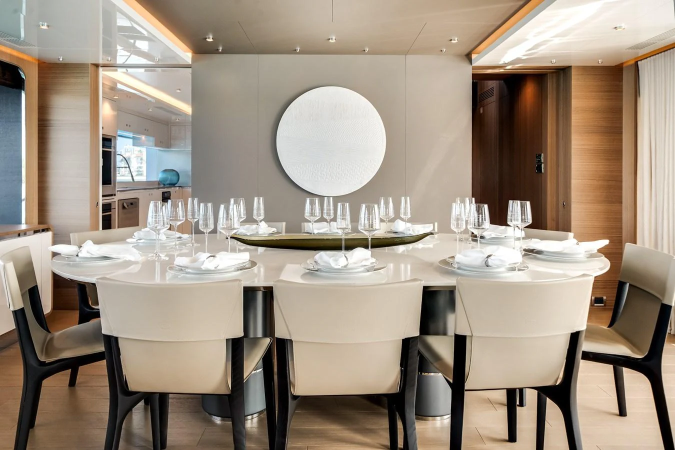 The dining area features a sleek, modern table set for an elegant meal. aboard OCEAN ALEXANDER 35P05 Yacht for Sale
