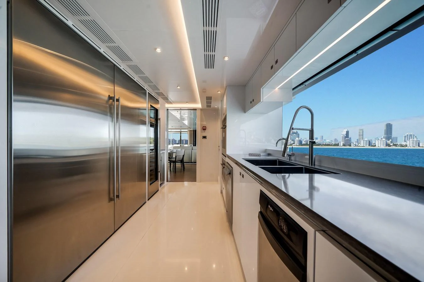 The sleek and modern galley offers stunning views of the city skyline through large windows. aboard OCEAN ALEXANDER 35P05 Yacht for Sale