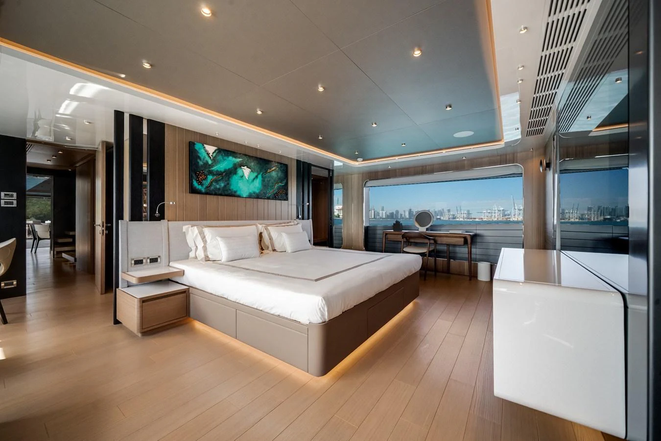 The master stateroom features a spacious bed, modern decor, and large windows offering stunning views. aboard OCEAN ALEXANDER 35P05 Yacht for Sale