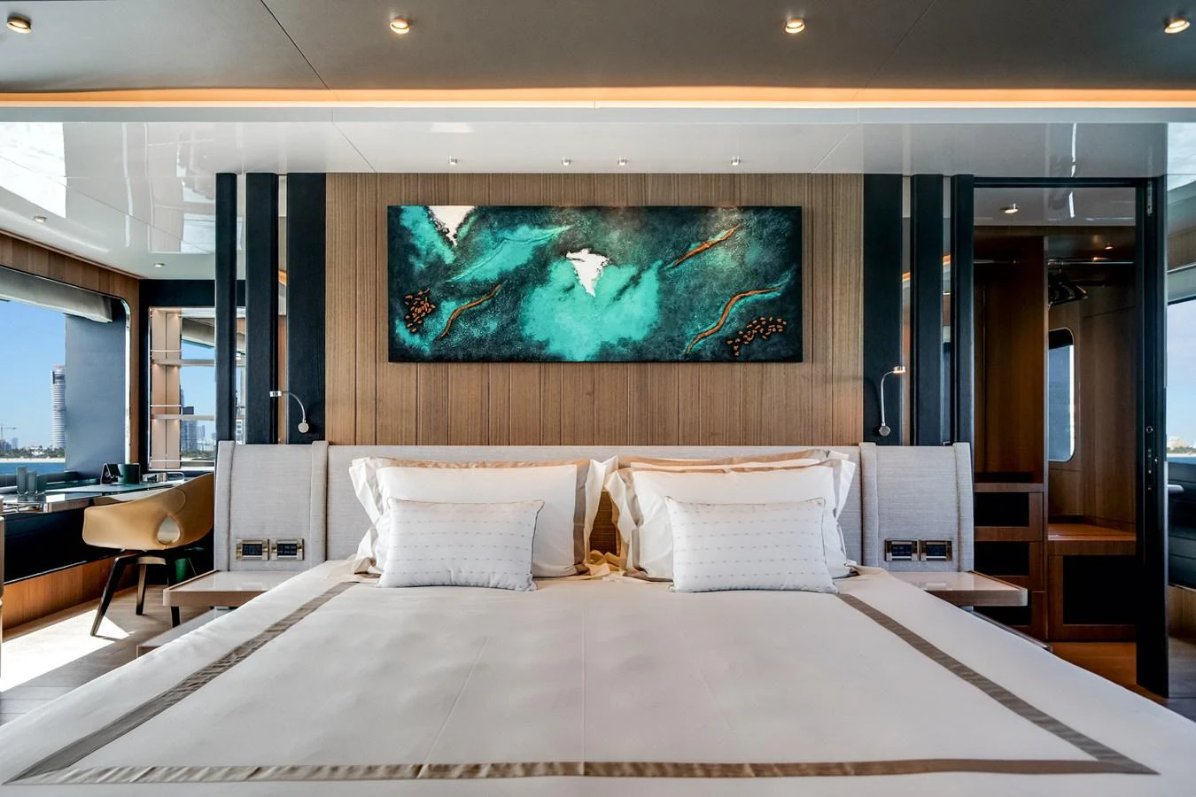 The master stateroom features a luxurious bed with elegant bedding and modern decor. aboard OCEAN ALEXANDER 35P05 Yacht for Sale