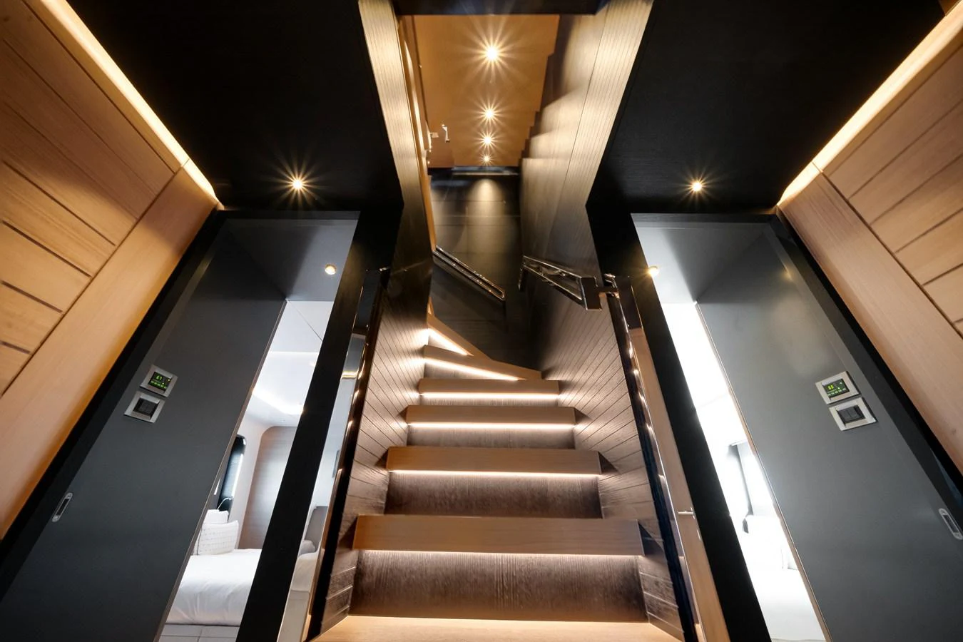 A luxurious staircase with modern lighting leads to the upper deck. aboard OCEAN ALEXANDER 35P05 Yacht for Sale