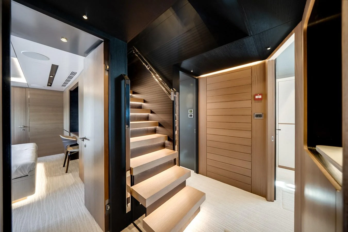 The yacht's interior features a modern staircase with sleek design elements and luxurious finishes. aboard OCEAN ALEXANDER 35P05 Yacht for Sale