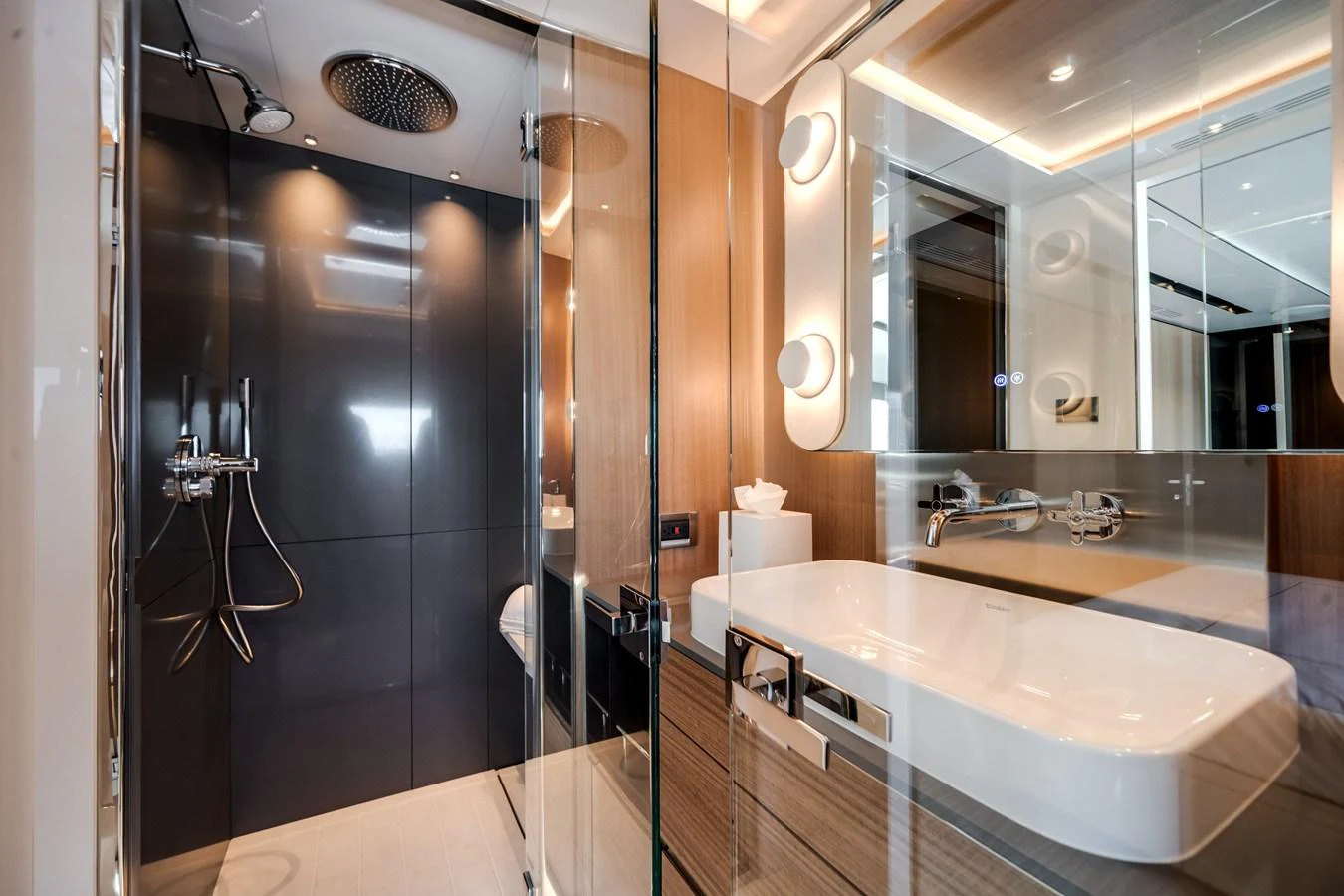 A modern yacht bathroom featuring sleek fixtures and a spacious shower area. aboard OCEAN ALEXANDER 35P05 Yacht for Sale