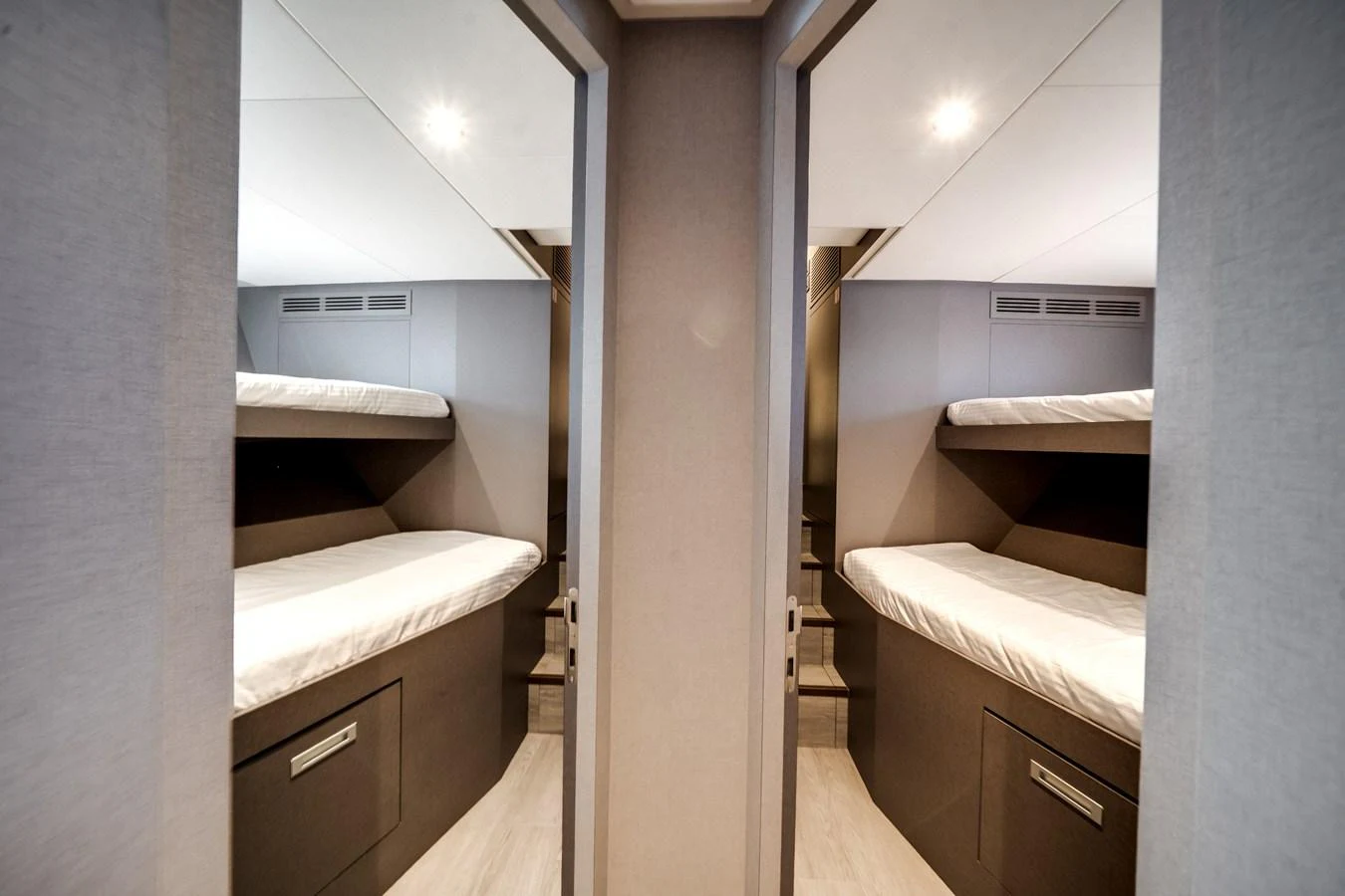 The guest cabin features twin bunk beds with modern, sleek design elements. aboard OCEAN ALEXANDER 35P05 Yacht for Sale