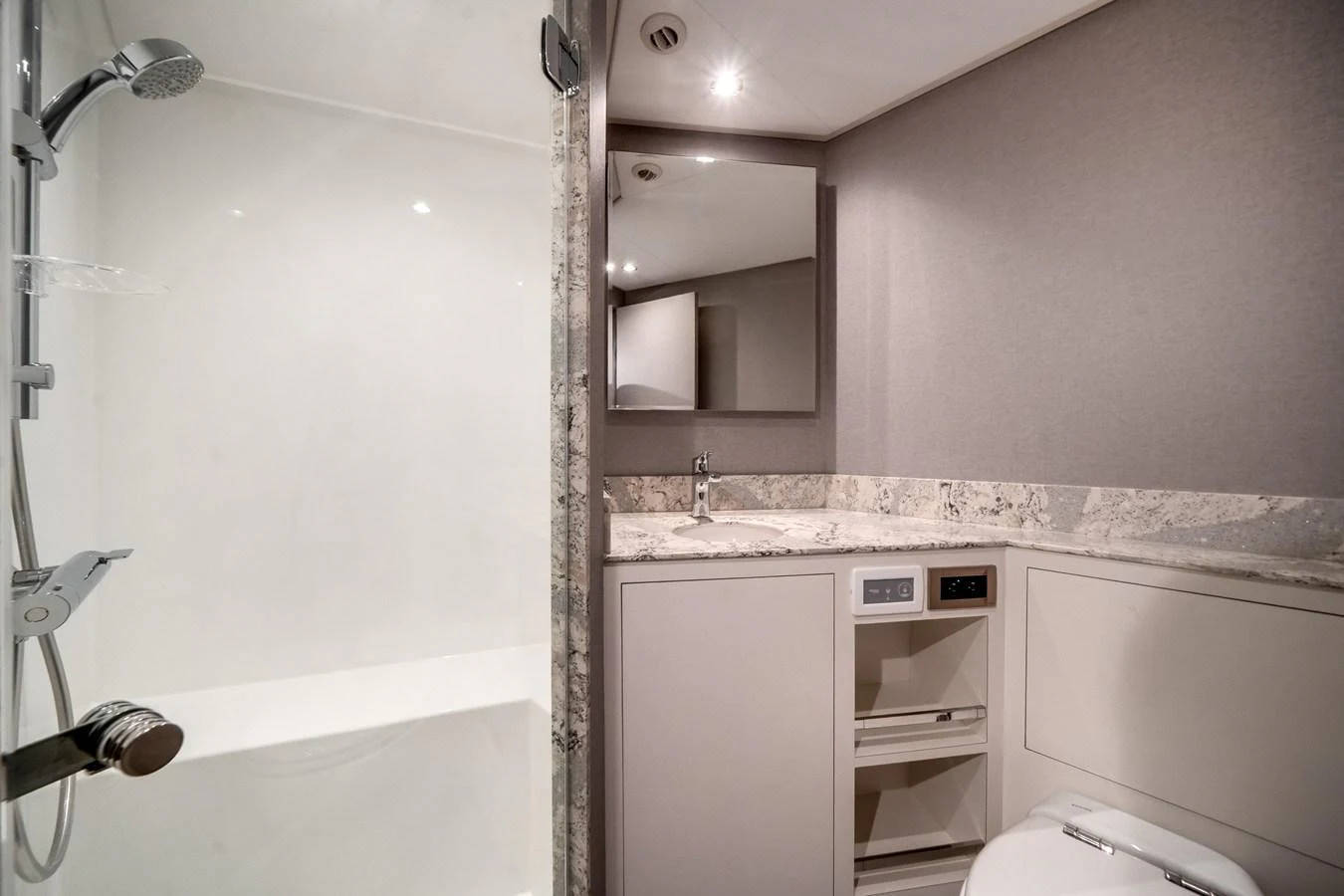A modern bathroom with a sleek design and high-end fixtures. aboard OCEAN ALEXANDER 35P05 Yacht for Sale