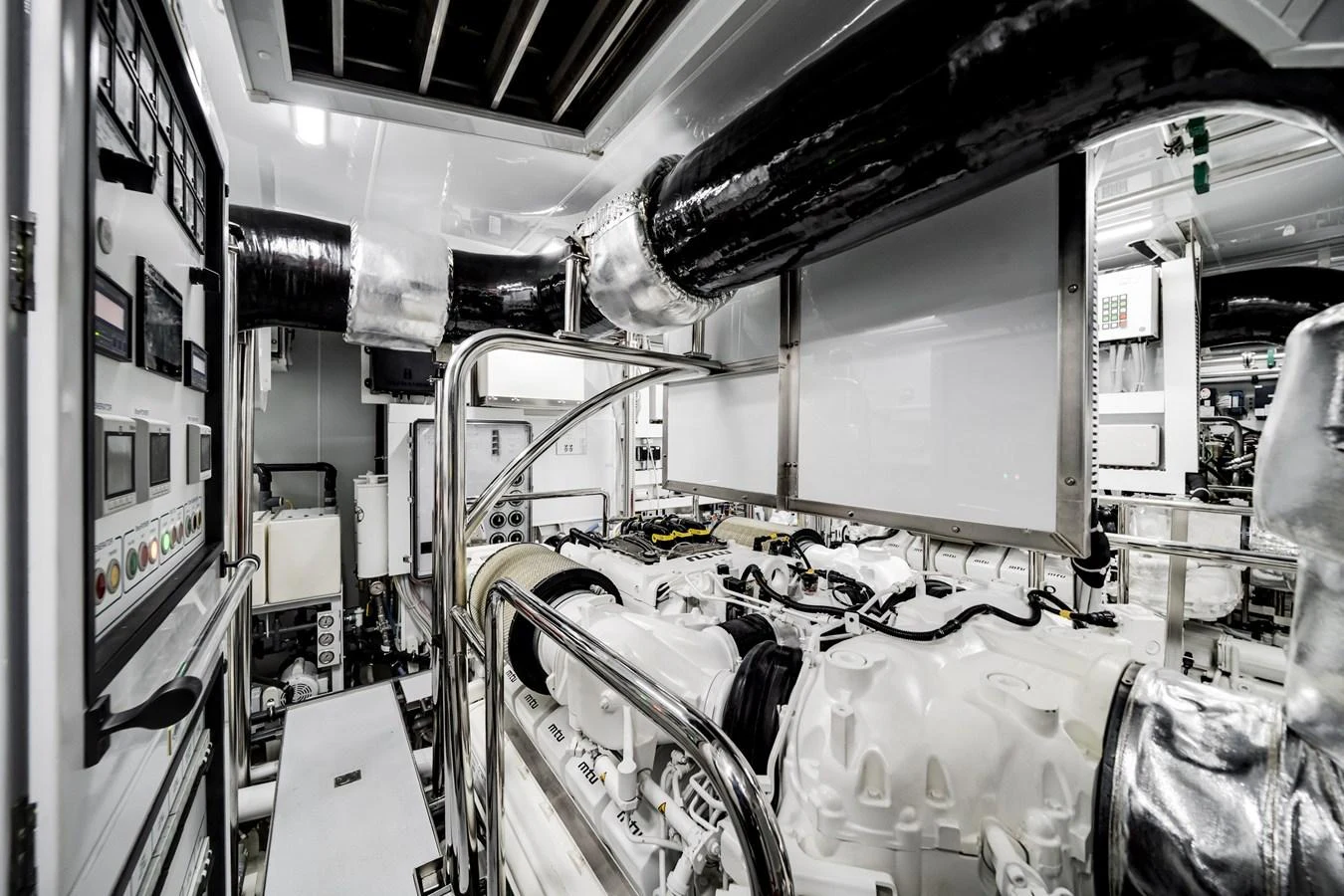 The engine room showcases advanced machinery and a clean, organized layout. aboard OCEAN ALEXANDER 35P05 Yacht for Sale