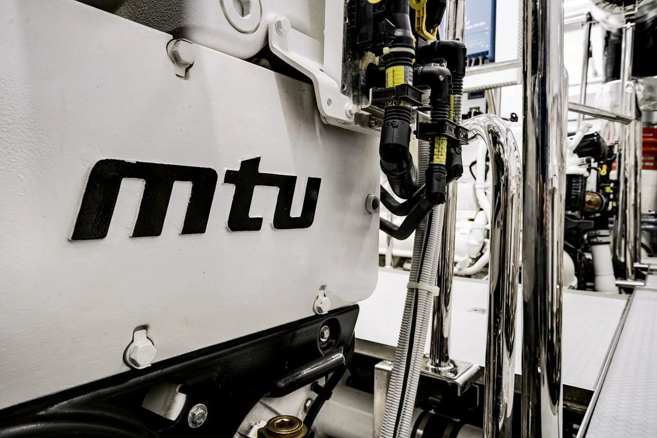 A close-up view of the yacht's engine room showcasing the MTU engine components. aboard OCEAN ALEXANDER 35P05 Yacht for Sale