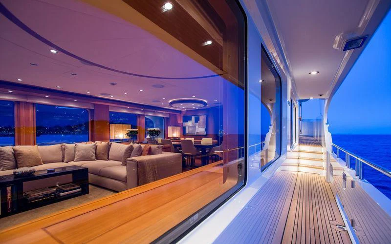 a large living room with a large balcony aboard GALENA Yacht for Charter
