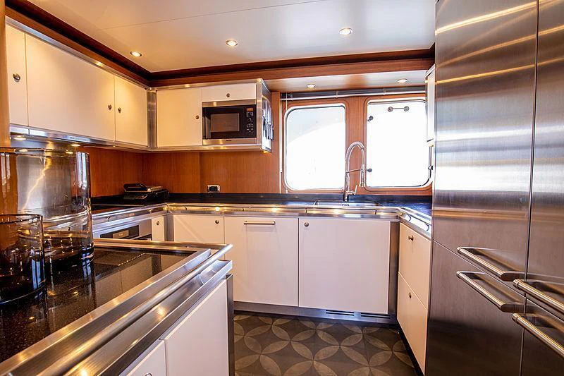 a kitchen with a glass door aboard GALENA Yacht for Charter