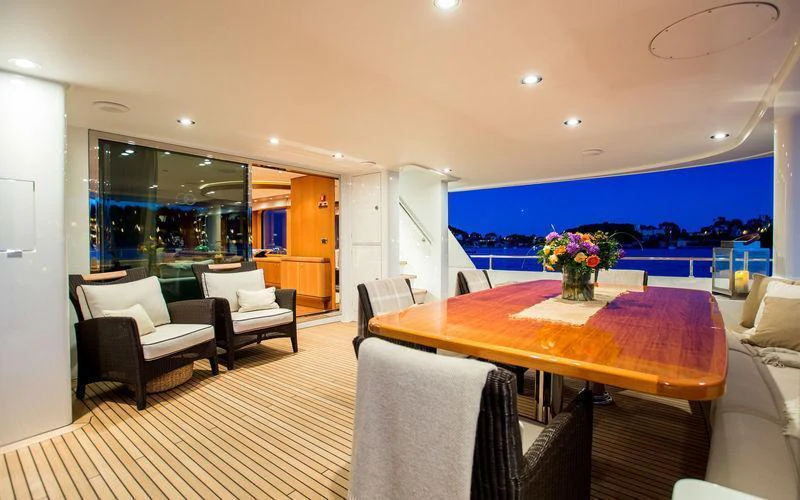 a large room with a table and chairs aboard GALENA Yacht for Charter