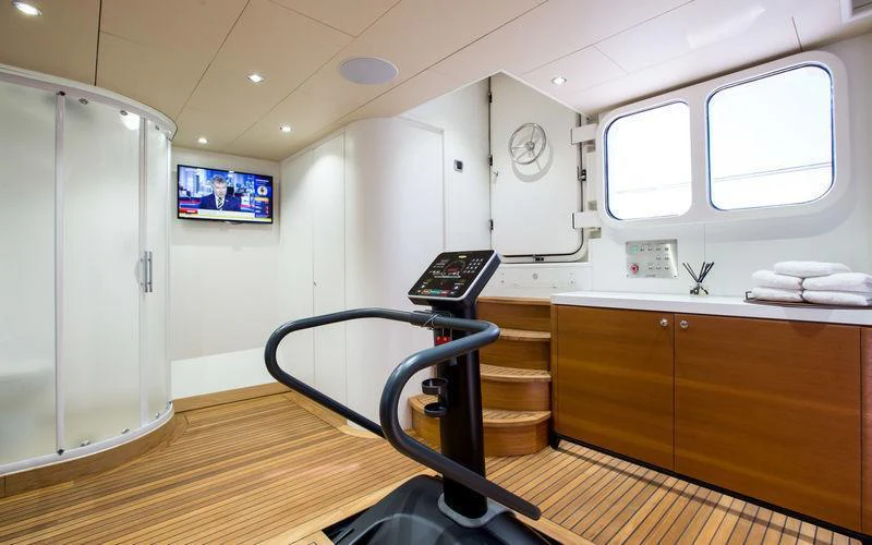 a room with a desk and a machine aboard GALENA Yacht for Charter
